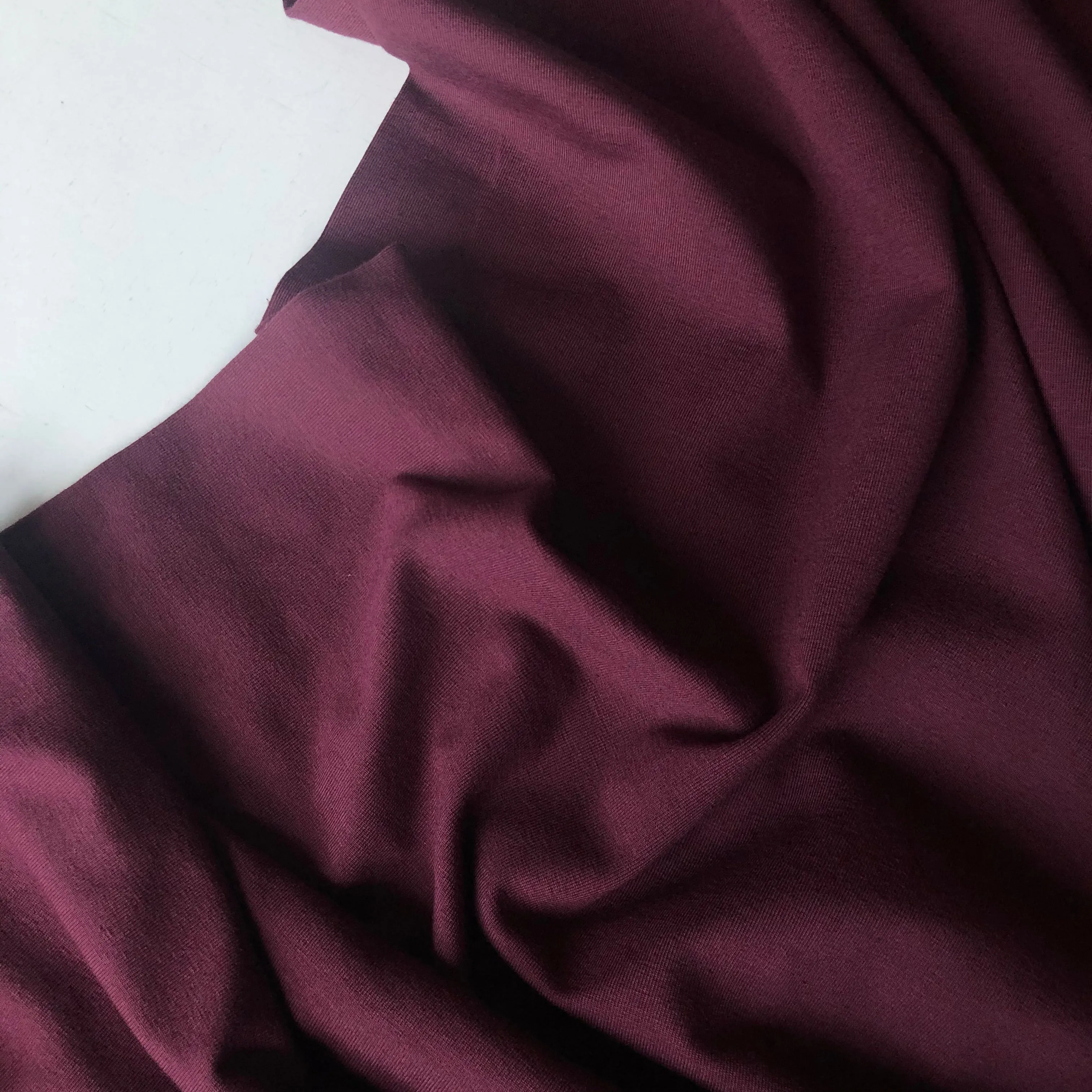 Essential Chic Aubergine Plain Cotton Jersey Fabric WITH FAULT (pull lines at every 4cm)