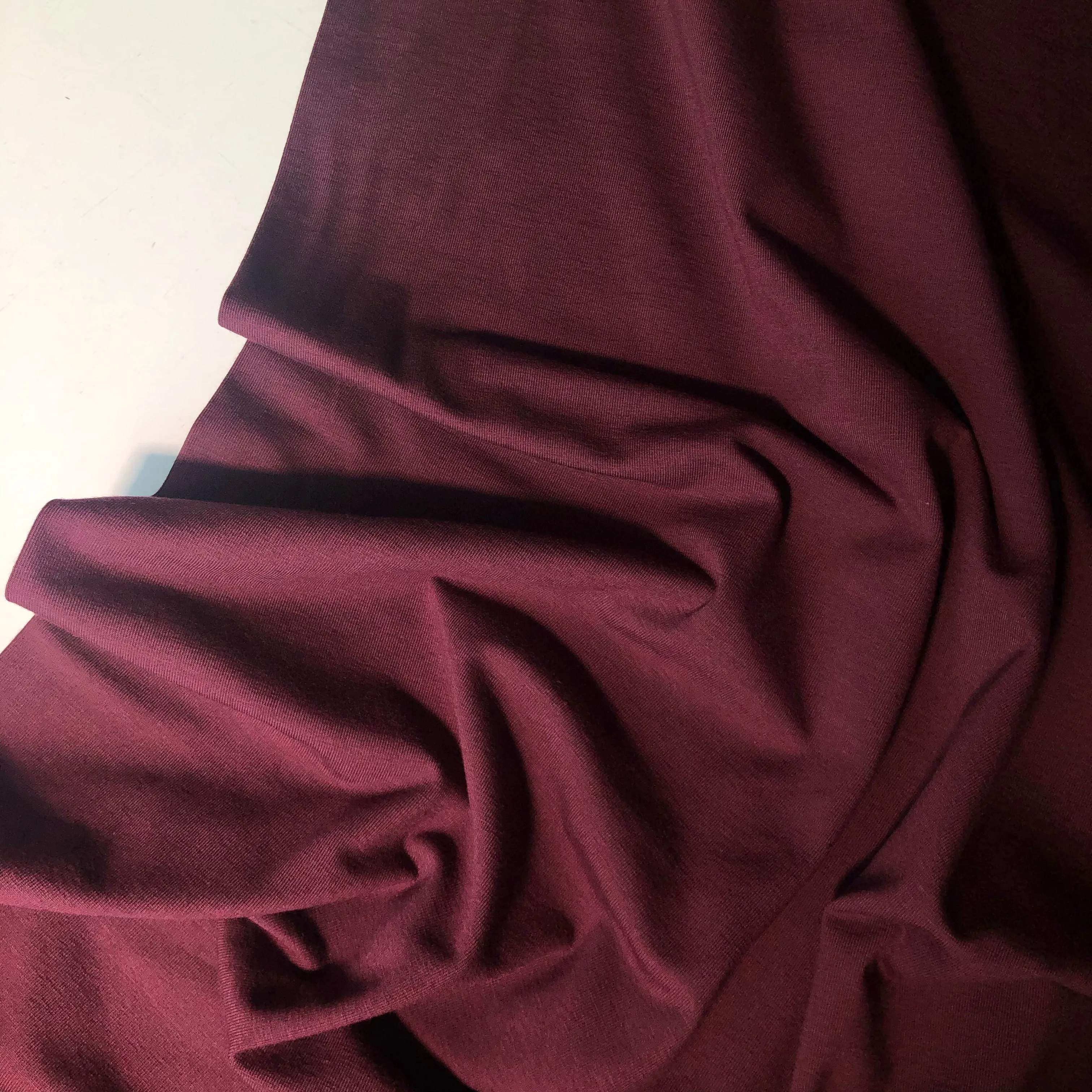 Essential Chic Aubergine Plain Cotton Jersey Fabric WITH FAULT (pull lines at every 4cm)